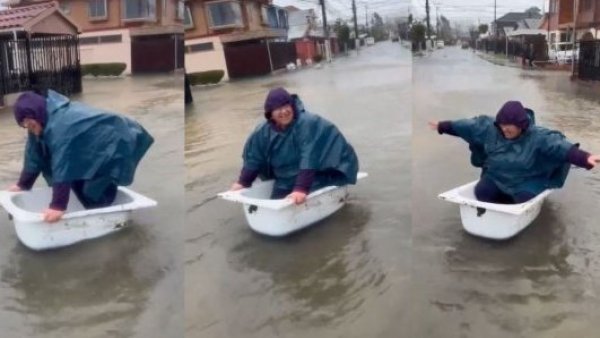 "¡¿A esto le llamas tormenta?!": mujer se hace viral por "navegar" en una tina en Coronel